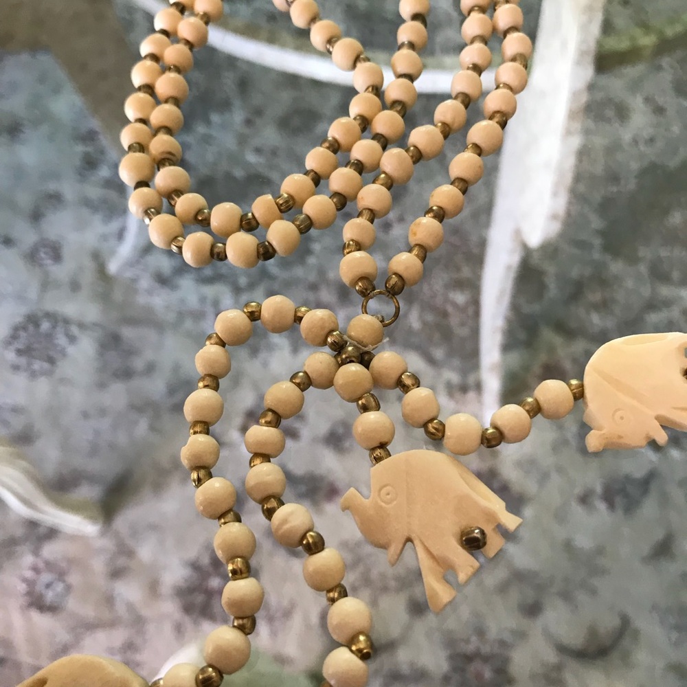 Woman’s elephant necklace, white, w/gold beads